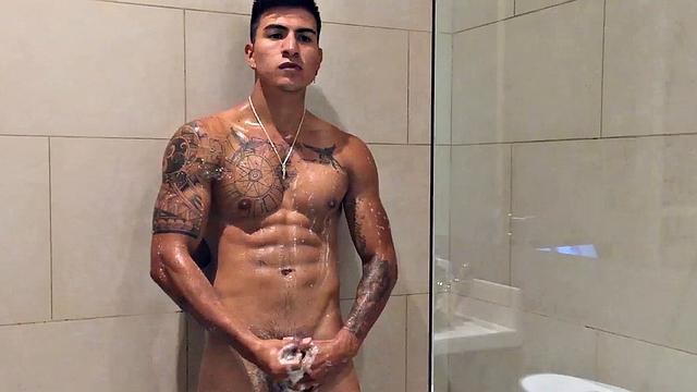 Our featured solo boy of the week is Erick, a muscular and inked young Latino who invites us to watch as he jerks off in the shower.