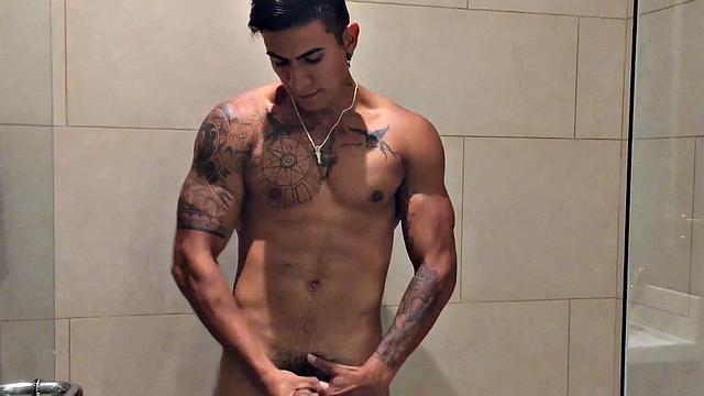 Our featured solo boy of the week is Erick, a muscular and inked young Latino who invites us to watch as he jerks off in the shower.