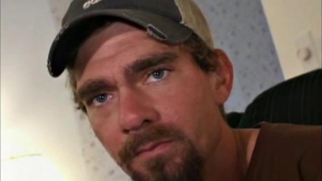 This rugged little street guy, with blue eyes, is 28 years old. He makes his living in the refrigeration business.