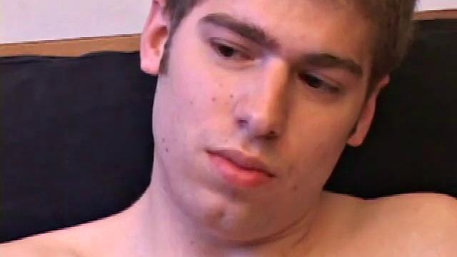 Adam Turner strips naked and grabs the lube, as he checks out a video that's playing. He works himself stiff and strokes with determination, until his cum starts pumping.