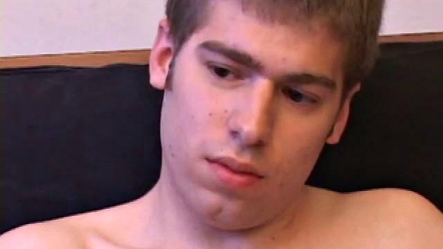 Adam Turner strips naked and grabs the lube, as he checks out a video that's playing. He works himself stiff and strokes with determination, until his cum starts pumping.