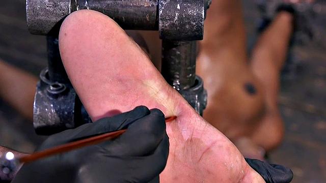 Feet tormented Ebony sub gets whipped by her master