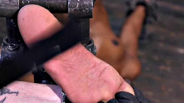 Feet tormented Ebony sub gets whipped by her master