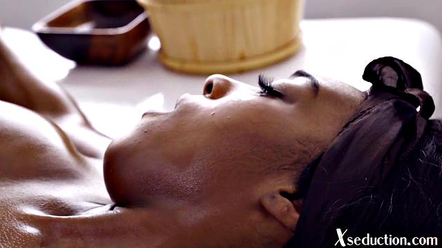 Ebony babe pussylicked by lesbo masseuse