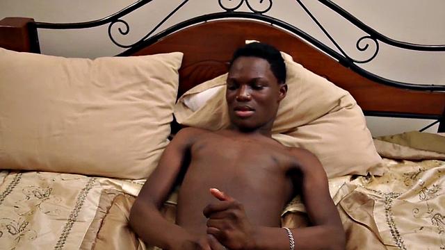 Skinny Nubian stroking his oiled shaft in solo