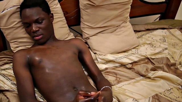 Skinny Nubian stroking his oiled shaft in solo