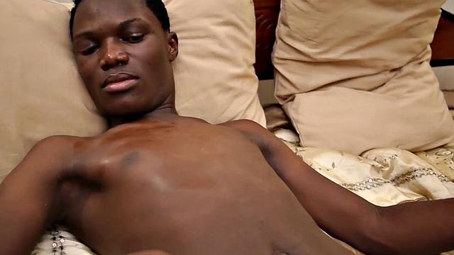 Skinny Nubian stroking his oiled shaft in solo
