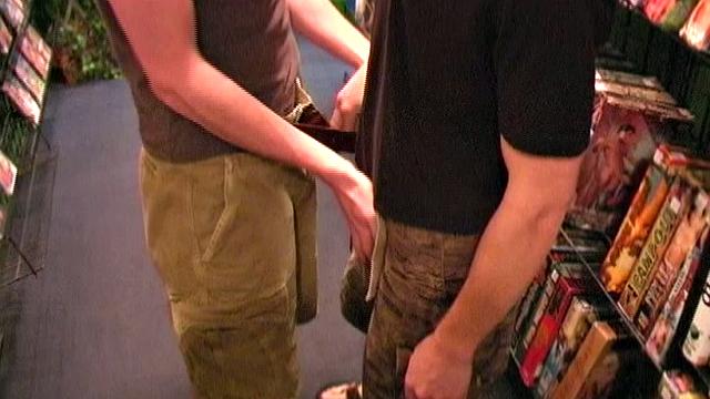 We look in on Trae and Blu as they are browsing the displays at a local adult bookstore before ducking back into the XXX room for some 1-on-1 action with each other. The boys trade blowjobs, swallowing each other's huge 8+ inch dicks.