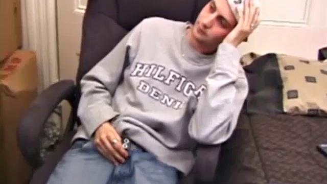 As a porno plays, Aaron strokes himself and pulls his cock out of his jeans. After a nice long stroke show, this man spills his warm sticky cum onto the bed.