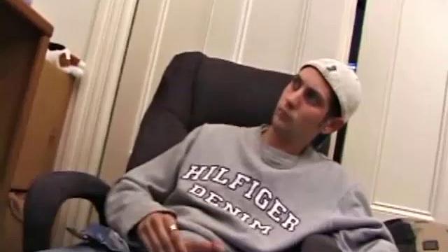 As a porno plays, Aaron strokes himself and pulls his cock out of his jeans. After a nice long stroke show, this man spills his warm sticky cum onto the bed.