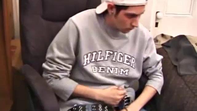 As a porno plays, Aaron strokes himself and pulls his cock out of his jeans. After a nice long stroke show, this man spills his warm sticky cum onto the bed.