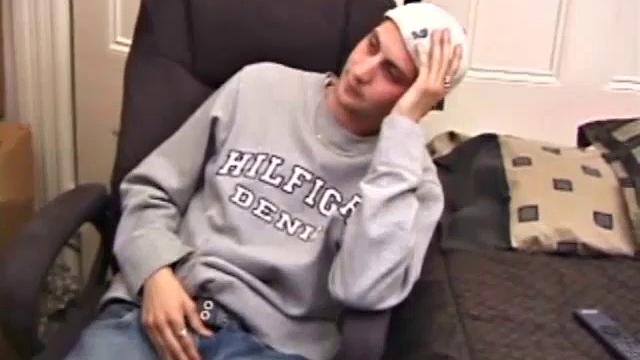 As a porno plays, Aaron strokes himself and pulls his cock out of his jeans. After a nice long stroke show, this man spills his warm sticky cum onto the bed.