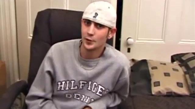 As a porno plays, Aaron strokes himself and pulls his cock out of his jeans. After a nice long stroke show, this man spills his warm sticky cum onto the bed.