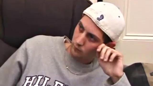 As a porno plays, Aaron strokes himself and pulls his cock out of his jeans. After a nice long stroke show, this man spills his warm sticky cum onto the bed.