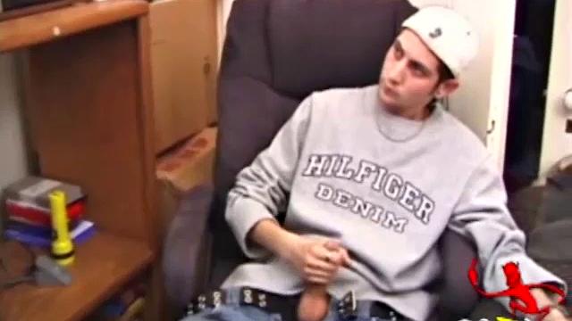 As a porno plays, Aaron strokes himself and pulls his cock out of his jeans. After a nice long stroke show, this man spills his warm sticky cum onto the bed.