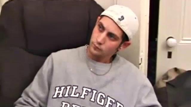 As a porno plays, Aaron strokes himself and pulls his cock out of his jeans. After a nice long stroke show, this man spills his warm sticky cum onto the bed.