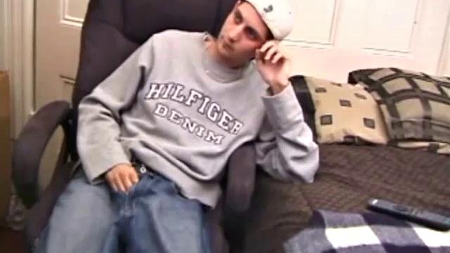 As a porno plays, Aaron strokes himself and pulls his cock out of his jeans. After a nice long stroke show, this man spills his warm sticky cum onto the bed.