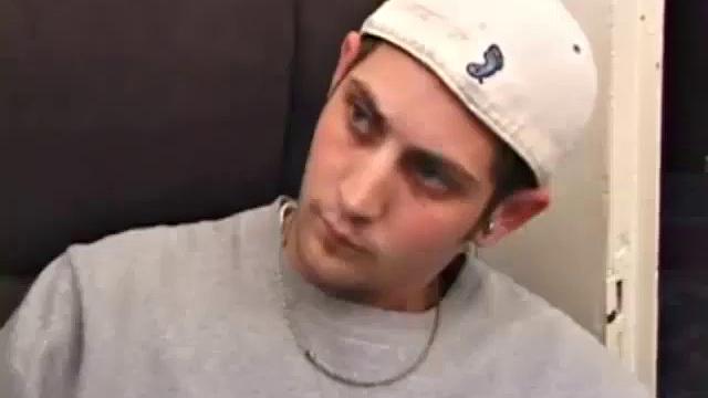 As a porno plays, Aaron strokes himself and pulls his cock out of his jeans. After a nice long stroke show, this man spills his warm sticky cum onto the bed.