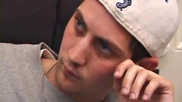 As a porno plays, Aaron strokes himself and pulls his cock out of his jeans. After a nice long stroke show, this man spills his warm sticky cum onto the bed.