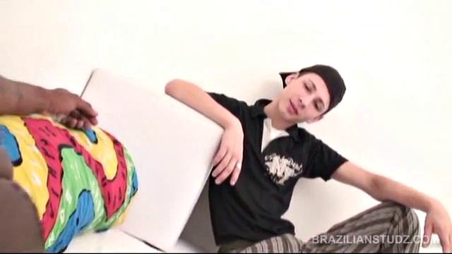 Riu Melo seems comfortable walking on the public beach with a boner in his pants, while chatting with Vidal Silva.