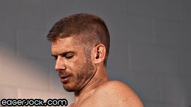 Muscled stud bouncing on gym coach