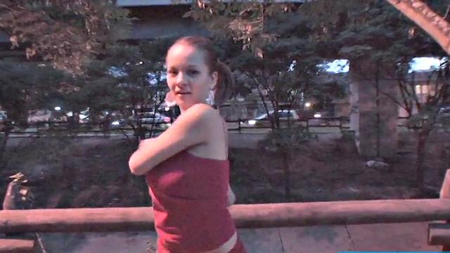 Busty teen jiggles her tits in public