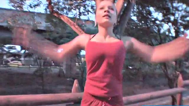 Busty teen jiggles her tits in public