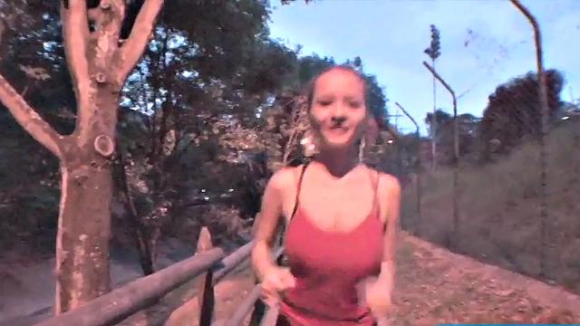 Busty teen jiggles her tits in public