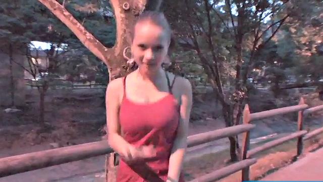 Busty teen jiggles her tits in public