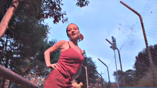 Busty teen jiggles her tits in public