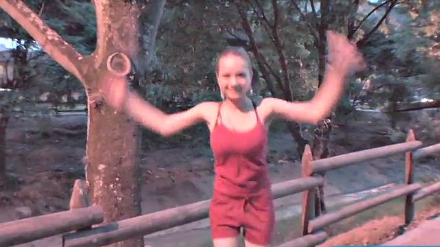 Busty teen jiggles her tits in public