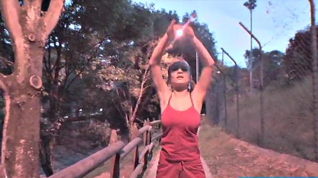 Busty teen jiggles her tits in public