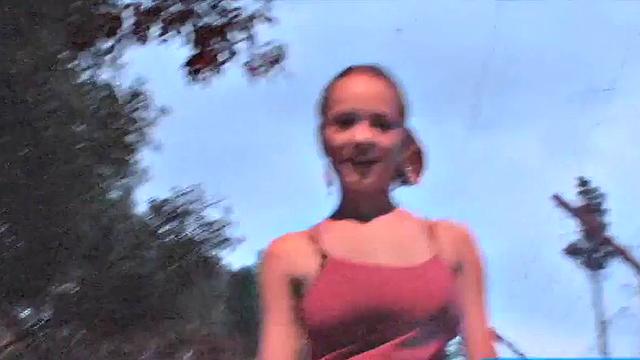 Busty teen jiggles her tits in public