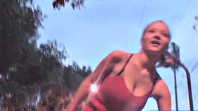 Busty teen jiggles her tits in public