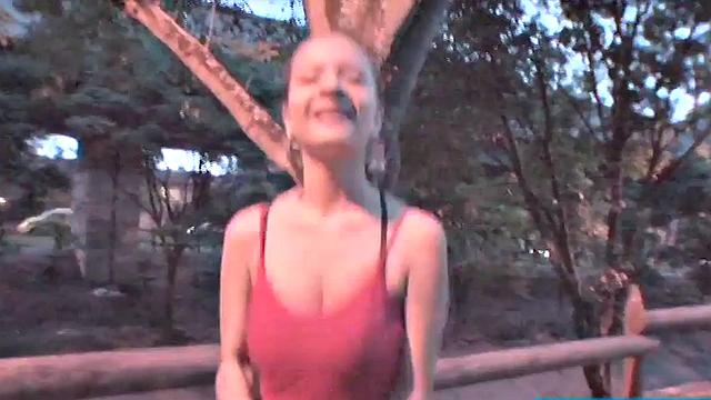 Busty teen jiggles her tits in public