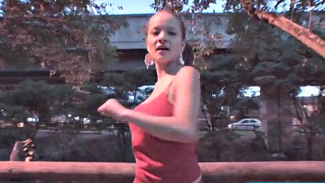 Busty teen jiggles her tits in public