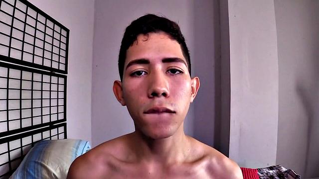 This cute Latin twink wants to please his daddy and starts by sucking his dick. Wearing only his shorts, the young man stands, strips naked and strokes his stiff cock, as daddy watches. Then he hops on daddy's waiting dick for a raw ride.