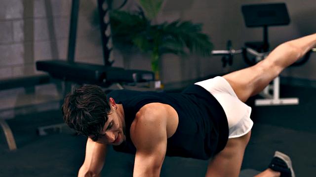 Athletic amateur barebacking in gym after workout