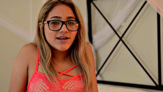 Nerdy Mila lounges in bed and cums