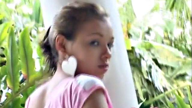 Sexy teen outdoors touches her pussy