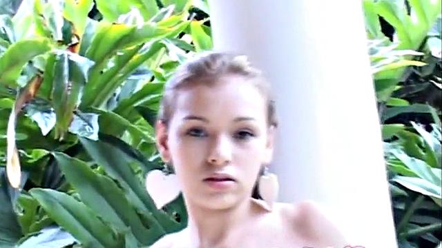 Sexy teen outdoors touches her pussy