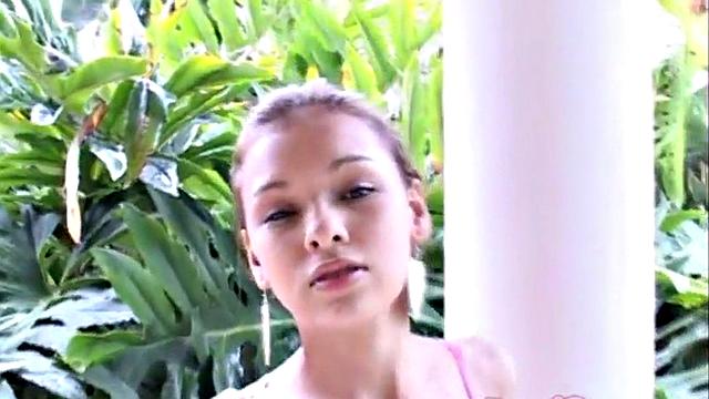 Sexy teen outdoors touches her pussy