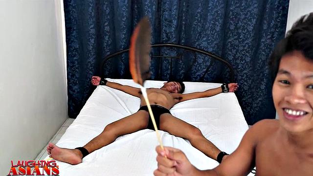 Warren Tickled By Two Boys