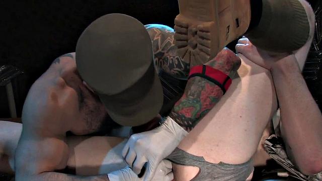 Tattooed jock with tattoos fists and sucks BF