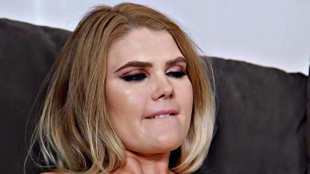 Hot MILF in high heels and skirt gets a sensual touch in the living room