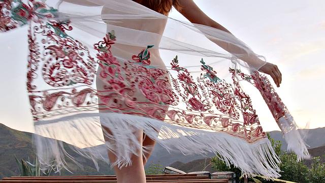 A hot redhead in high heels finger her trimmed pussy and lingerie while playing with herself in the indoors