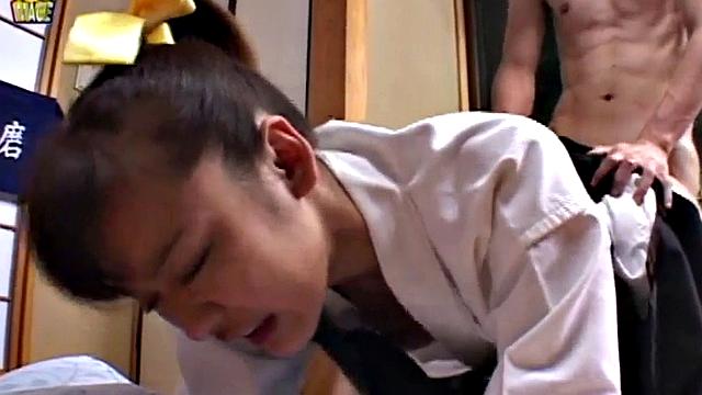 Doggystyled Japanese teen gets wet with finger.