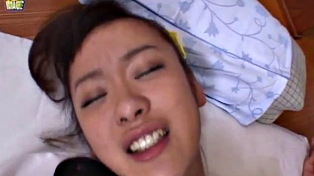 Doggystyled Japanese teen gets wet with finger.