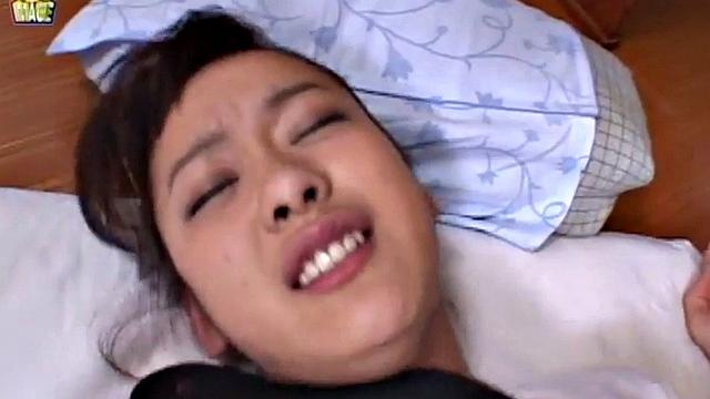 Doggystyled Japanese teen gets wet with finger.