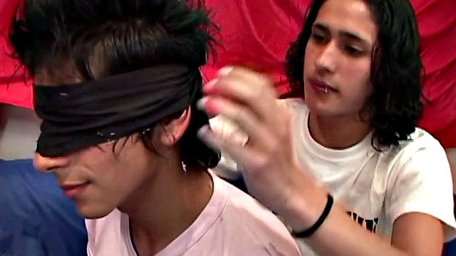 After blindfolding young Boris, Juan Carlos pulls the boy's shirt off and feeds him his stiff cock. Boris does his best to suck on it, before Juan stuffs a banana in his ass.